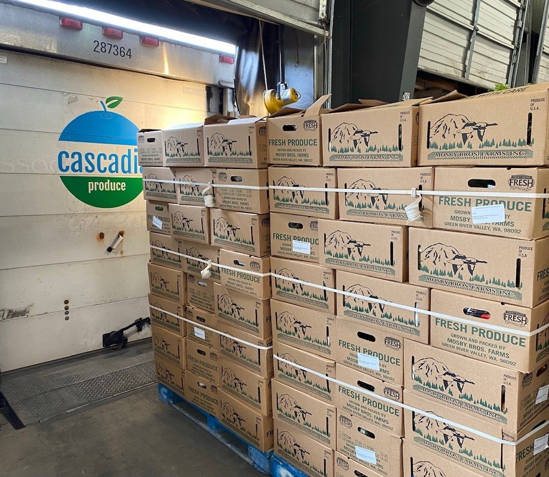 Pallets of Cascadia Produce fresh food boxes in the Auburn warehouse